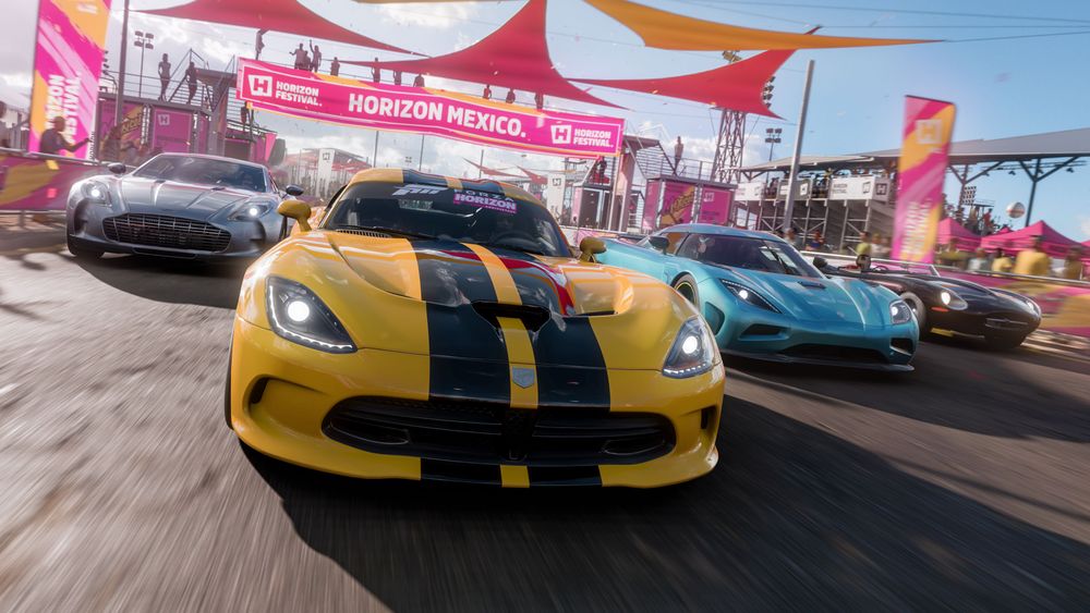 The four returning cars in the Horizon 10-Year Anniversary update driving through the Festival: 2010 Ferrari 599XX, 2011 Koenigsegg Agera, 2012 Eagle Speedster and 2010 Aston Martin One-77.