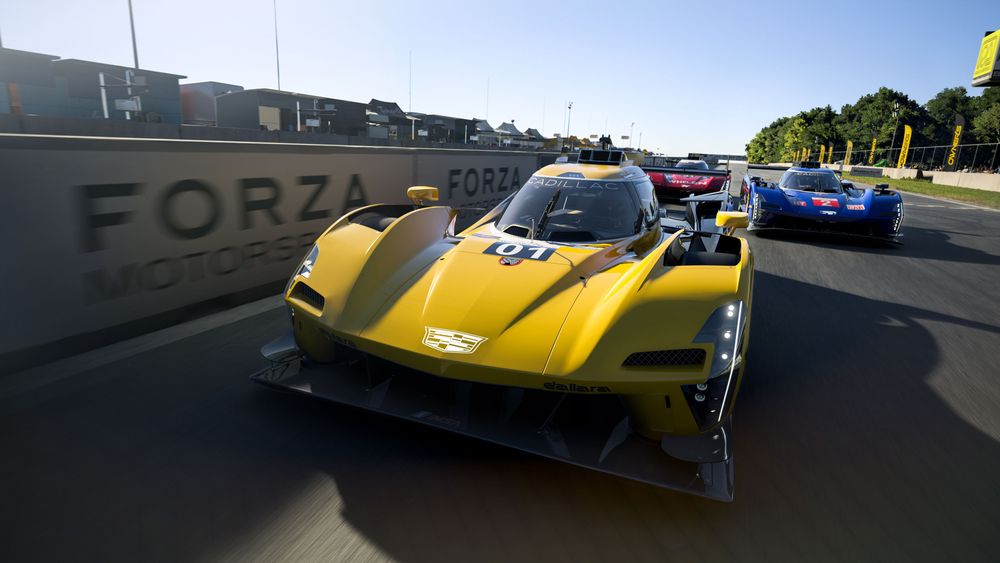 2023 #01 Cadillac Racing V-Series.R in yellow racing with other racecars.