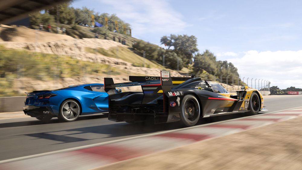 Yellow 2023 number 01 Cadillac Racing V-Series.R and the blue 2024 Chevrolet Corvette E-Ray road car.  They are driving at speed, side by side, travelling from the left side of the image and face to the right side of the image.