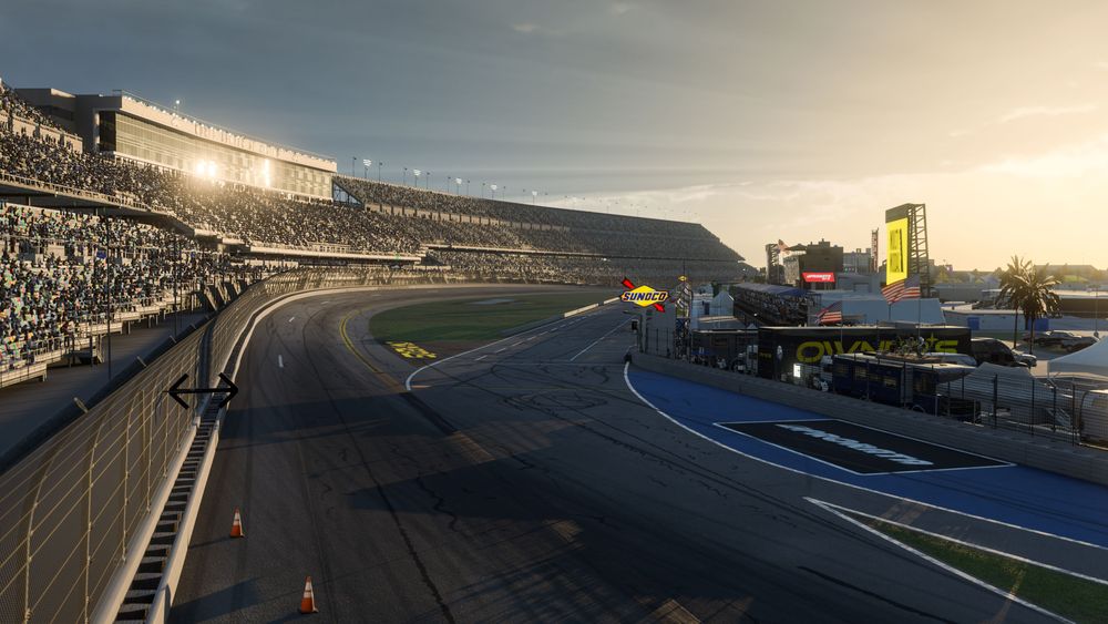 Daytona track at sunset with a roaring crowd