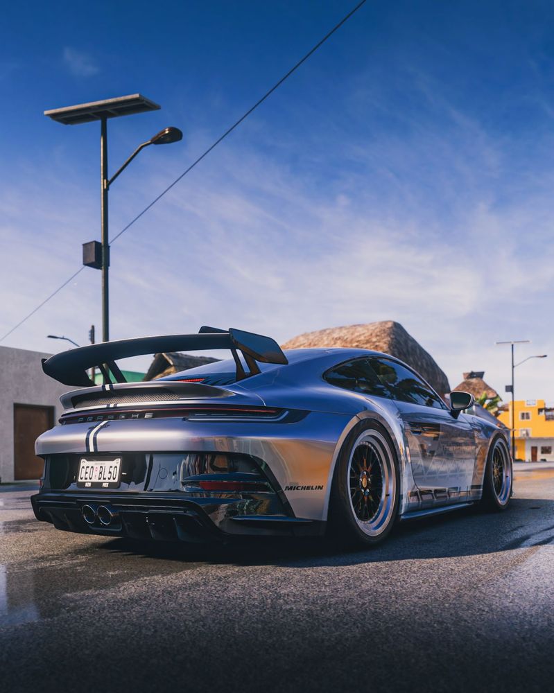 The rear quarter view of a modern Porsche.