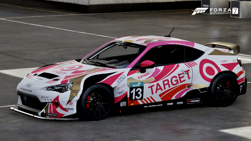 A sports car with colorful Target themed livery is parked in the FM7 garage space.