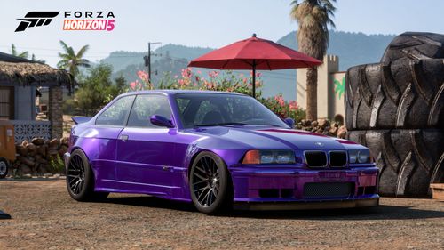 A purple 1997 BMW M3 fitted in the StreetFighter LA body kit.