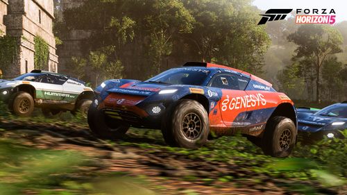 Three Extreme E off-road race cars approach historic ruins deep in the Mexican jungle.