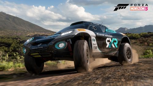 The 2022 Extreme E #6 Rosberg X Racing adorned in a black, silver and teal team livery kicks up dirt in Mexico's arid lands.