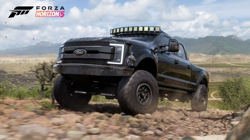 DeBerti Ford Super Duty F-250 Lariat 'Transformer' going up a rock and dirt road