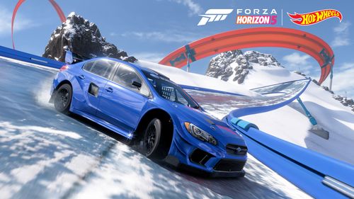 Blue Subaru WRX STI ARX Supercar drifting on a snowy Hot Wheels track.