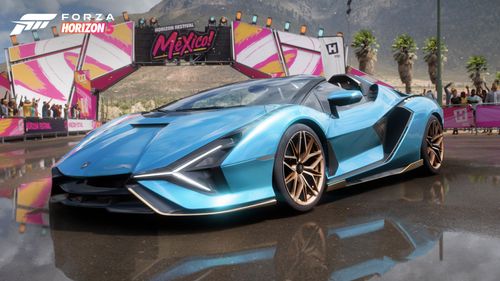 A blue 2020 Lamborghini Sián Roadster parked by a Horizon Mexico Festive sign.