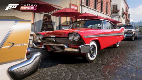 A red 1958 Plymouth Fury parked on a street in Guanajuato.