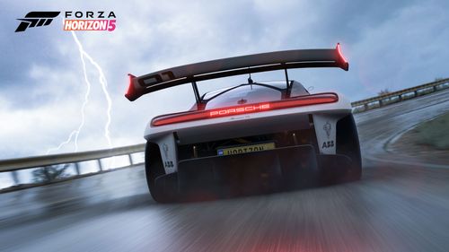 Porsche Mission R driving during a thunderstorm from the back