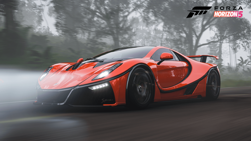 A GTA Spano driving through a foggy forest with its headlights on