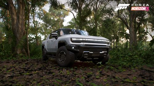 GMC Hummer EV Pickup going off-road in a forest