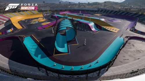 An aerial view of the Stunt Park with blue, yellow and purple props including ramps, tubes, half-pipes and other drivable objects.