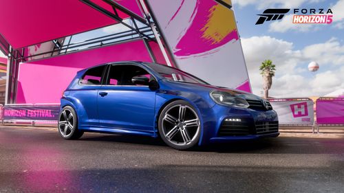 A blue VW Golf R shows off the APR Performance widebody kit in FH5.