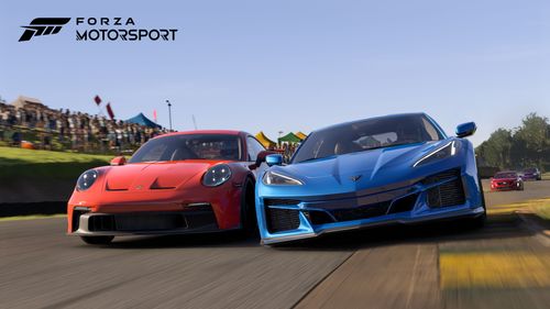 Two road-going sports cars battling for position at a circuit.  The cars are facing toward the camera with a red Porsche 911 on the left side of the image and a blue Corvette on the right side of the image, it is day time with clear skies and a helicopter