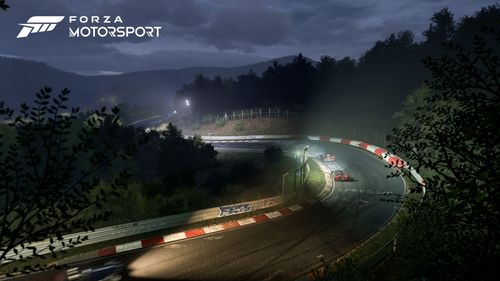 Nordschleife hosting a night race with two cars taking a corner 